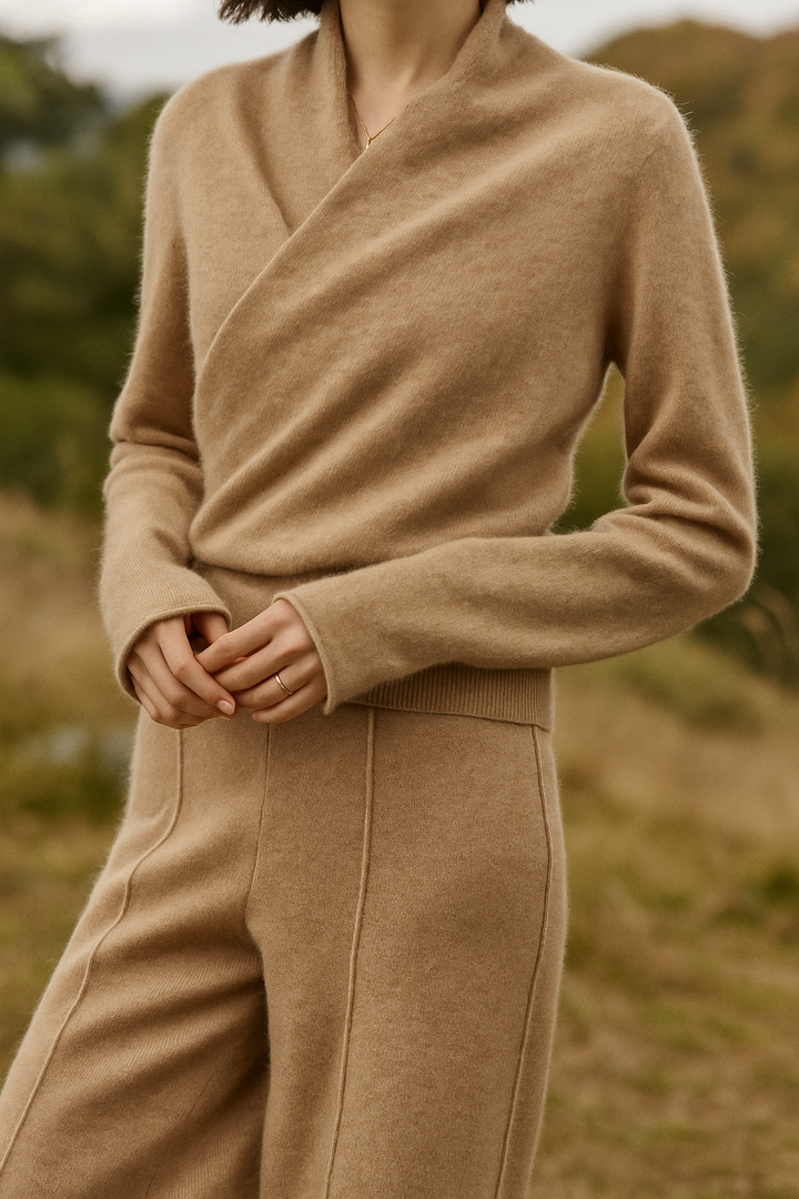 Close-up of the fabric's soft texture on an elegant women's long sleeve wrap sweater.