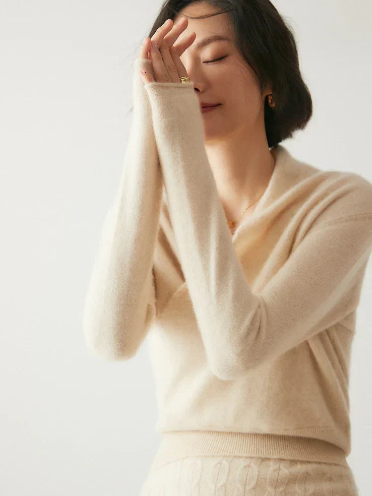 Front view of the women's elegant grey crossover wrap sweater, a winter fashion essential.