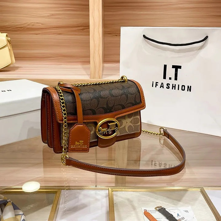 Versatile women's designer shoulder bag with a stylish colorblock strap, ideal for everyday chic.