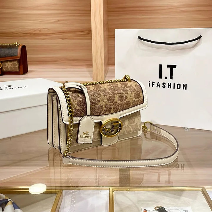 Fashionable women's elegant designer crossbody bag featuring a striking colorblock strap, a must-have accessory.