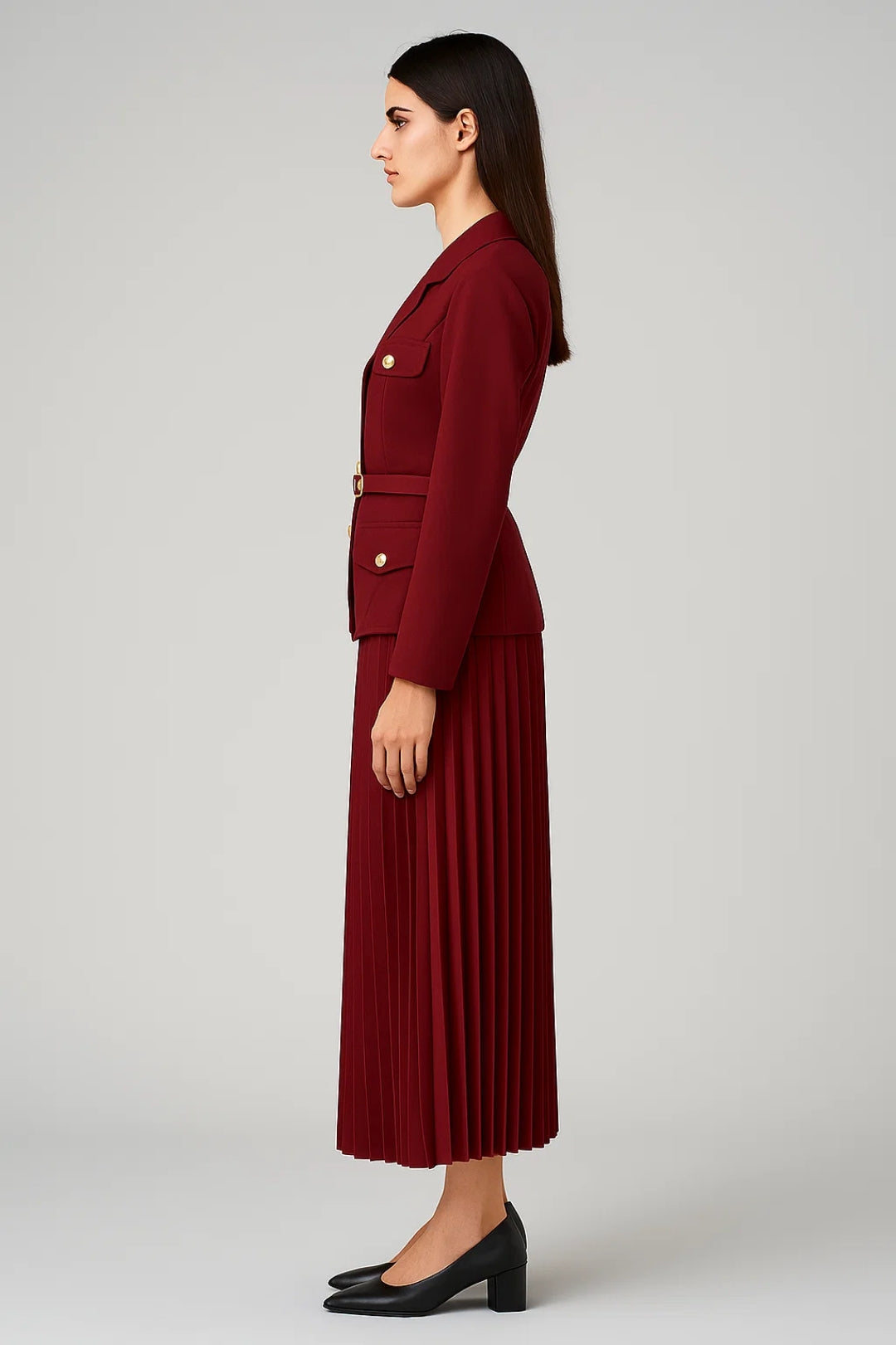 Fashionable coordinated women's outfit featuring a double-breasted blazer and a stylish pleated skirt.