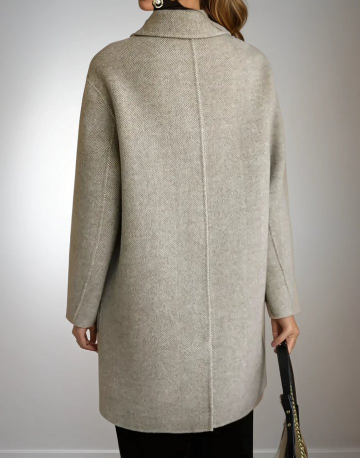 Classic black cashmere feel double-breasted coat for women, model wearing a stylish winter outerwear.