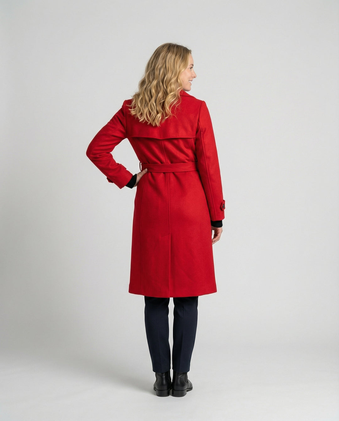 Sophisticated women's tailored full-length coat, double-breasted design for elegant formal attire.