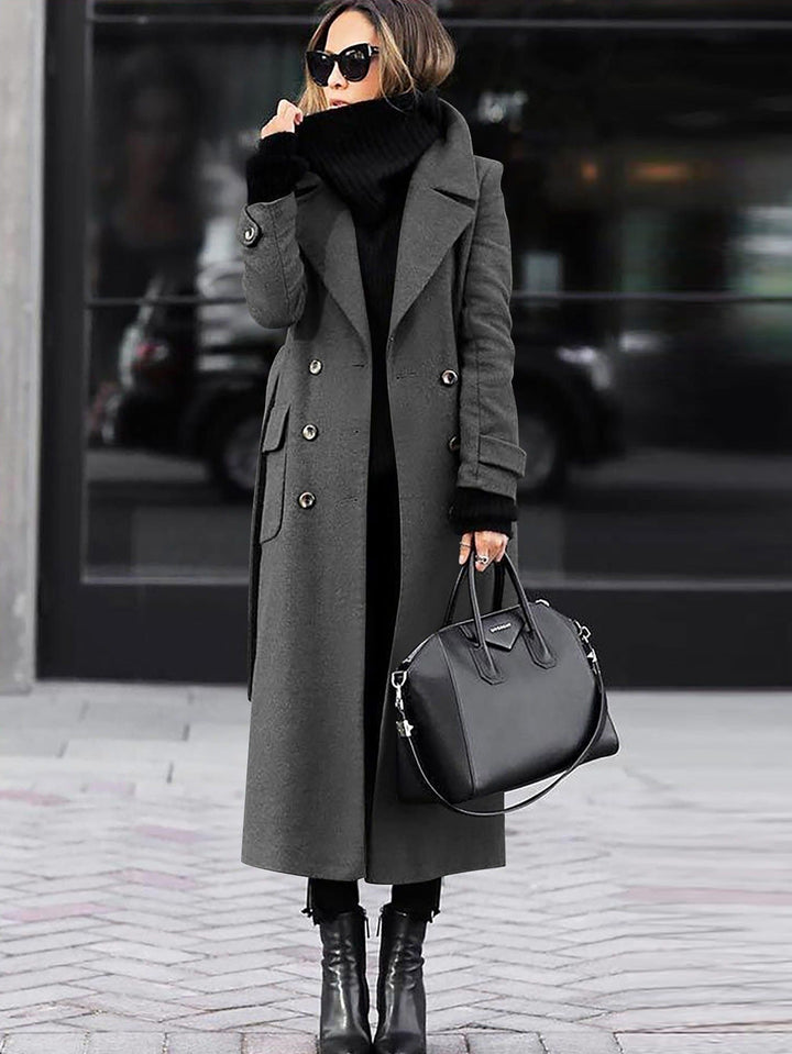 Luxurious women's double-breasted full-length coat, tailored fit for elegant cold weather outerwear.
