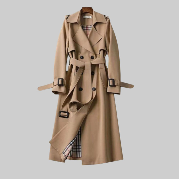 Elegant women's double-breasted long trench coat with belt, perfect for fall and winter outerwear.