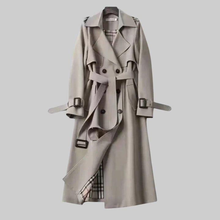 Classic women's double-breasted trench coat featuring elegant buttons and a cinched belt for a sophisticated silhouette.