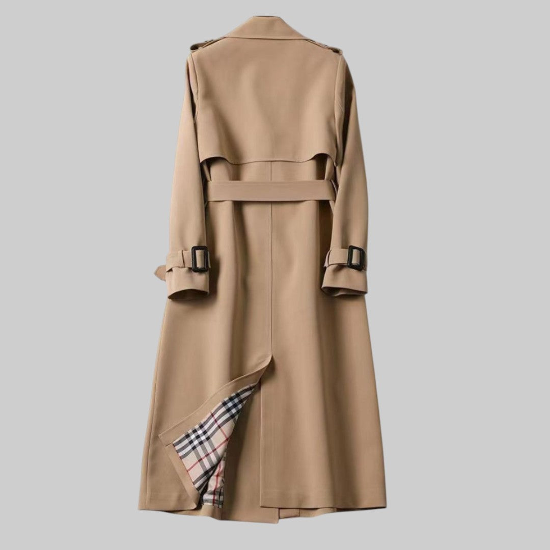 Elegant women's long belted trench coat, double-breasted outerwear perfect for a classic and sophisticated fall look.