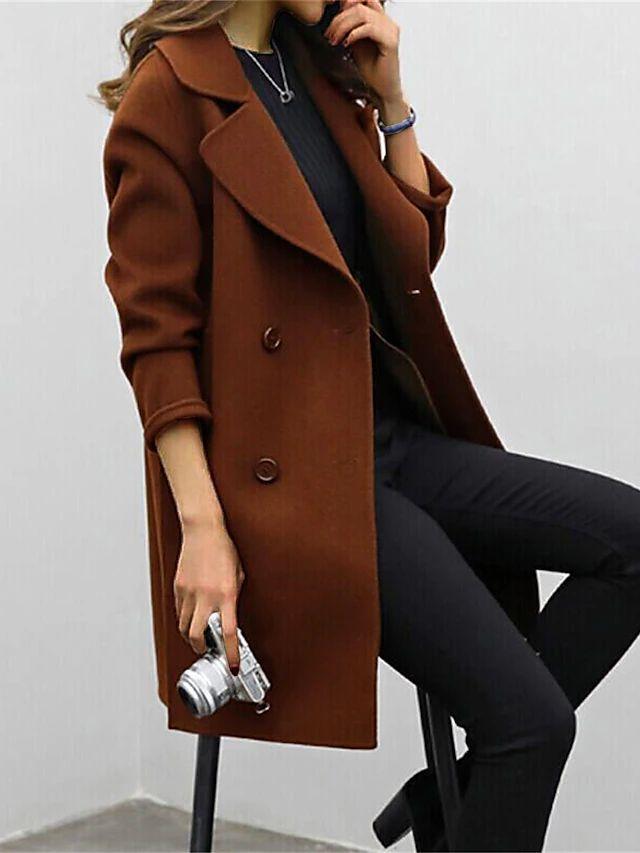 Classic women's longline winter coat, double breasted design for a fashionable and warm look.