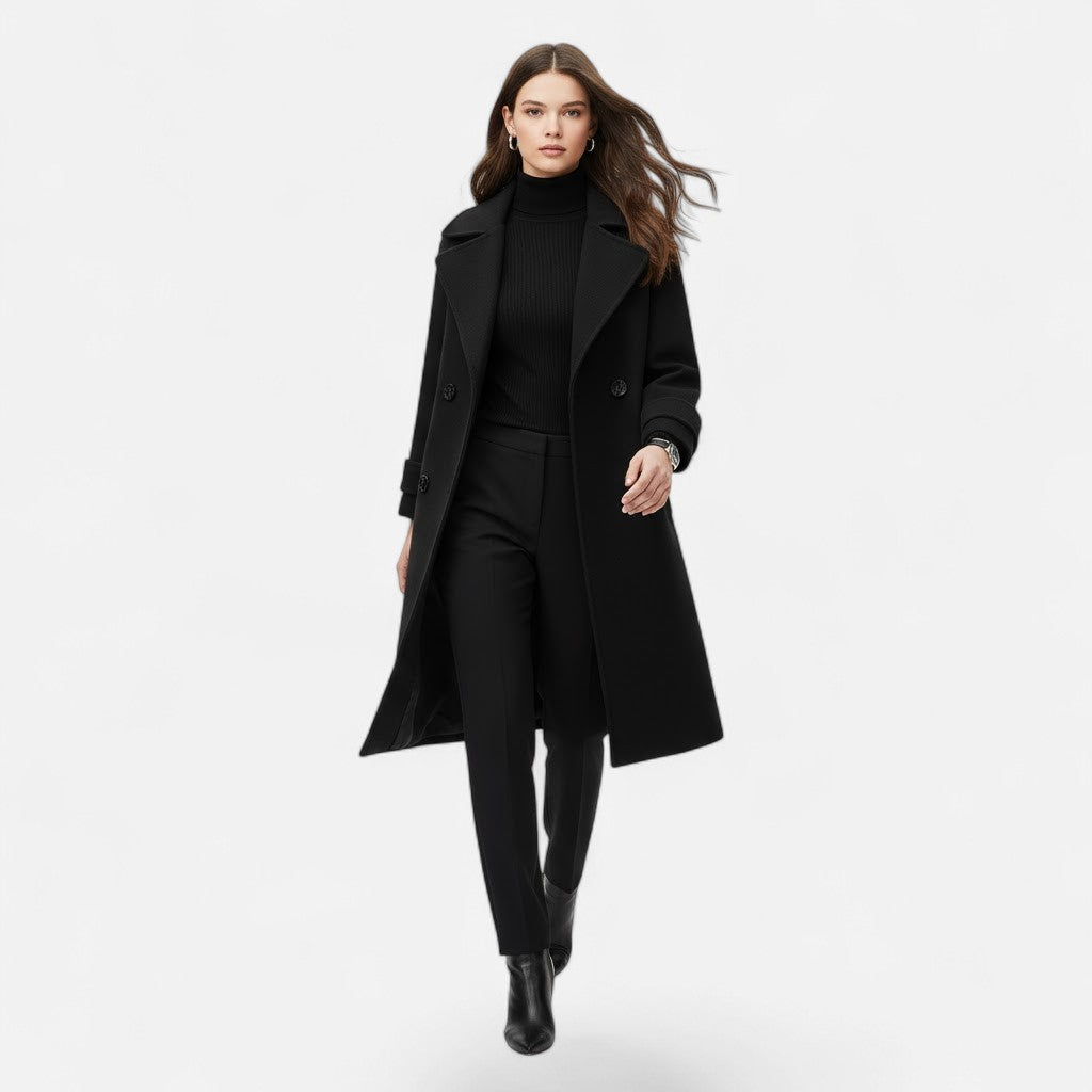 Chic women's slim fit overcoat. Double-breasted long jacket, elegant outerwear perfect for classic winter style.