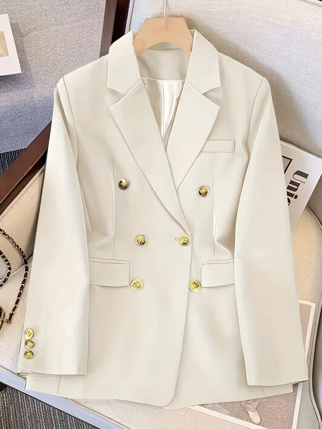 Tailored women's black double-breasted blazer for business casual and formal wear, classic long sleeve outerwear