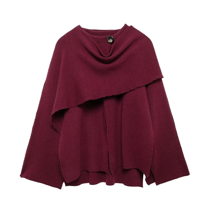 Full-length view of a woman wearing an elegant draped cape coat, highlighting its sophisticated silhouette.