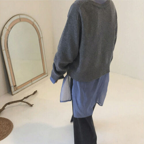 Close-up of soft faux cashmere knit on a women's elegant wrap cardigan, black