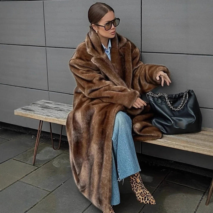 Elegant women's faux fur coat, a luxurious winter outerwear piece. Soft, plush, and fashionable.