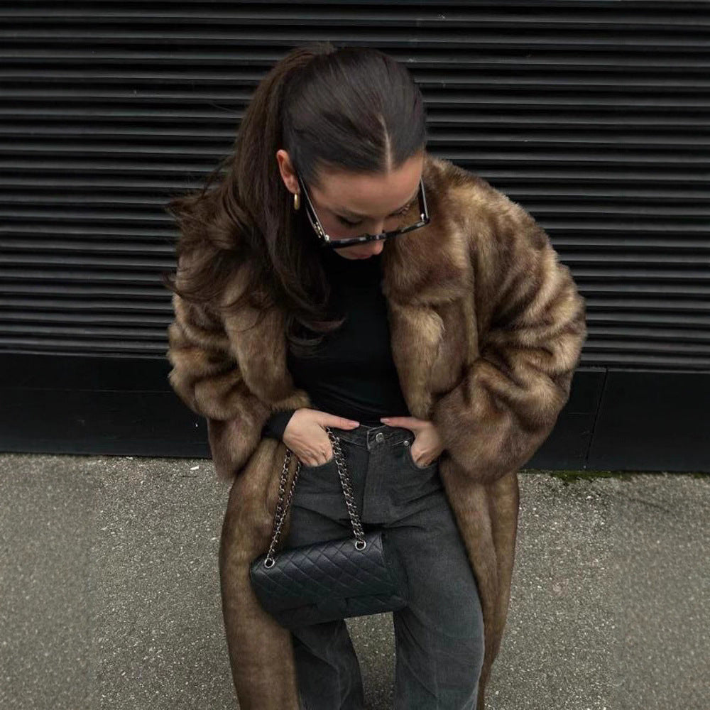 Luxurious women's faux fur coat, offering ultimate warmth and soft comfort. An elegant statement piece for winter.