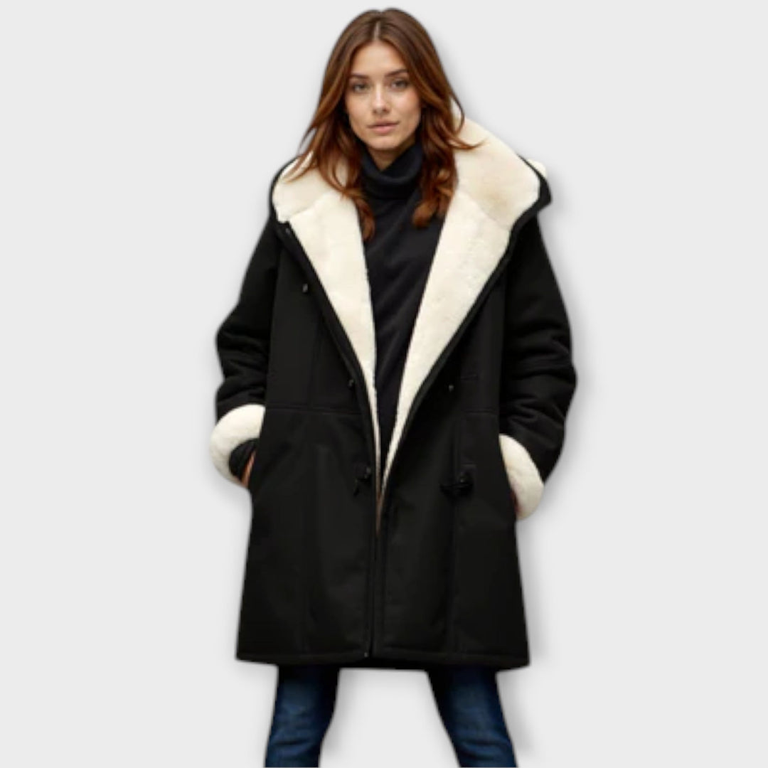 Elegant women's faux fur lined winter coat with long sleeves, perfect for cold weather fashion.