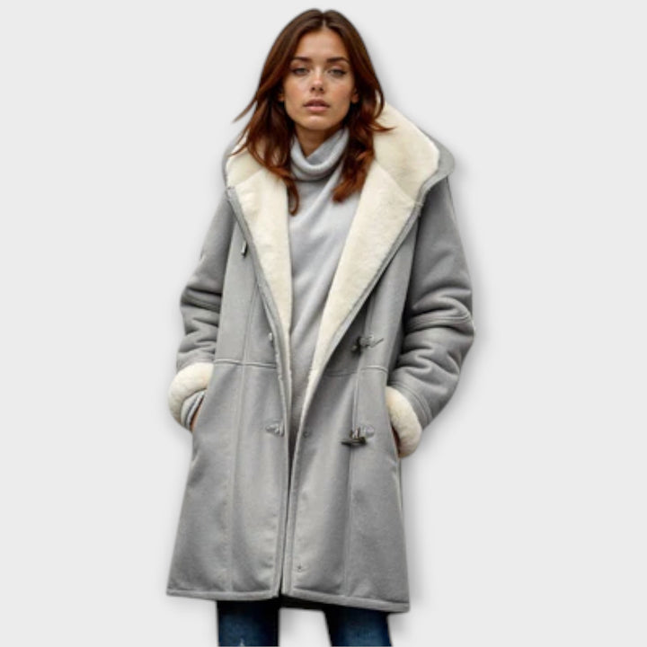Women's long sleeve faux fur winter coat, an essential for elegant, warm cold weather fashion.