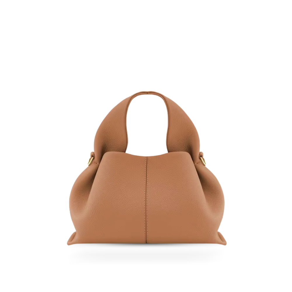 Elegant women's faux leather shoulder bag with magnetic closure, versatile for everyday use.