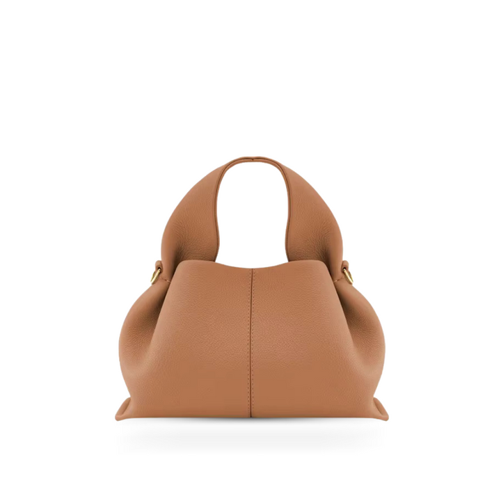 Elegant women's faux leather shoulder bag with magnetic closure, versatile for everyday use.