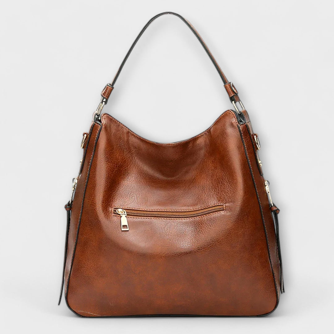 Stylish women's black faux leather shoulder bag with spacious interior for daily essentials