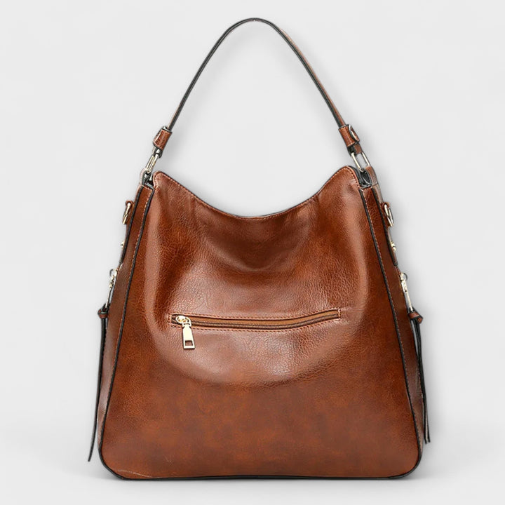 Stylish women's black faux leather shoulder bag with spacious interior for daily essentials