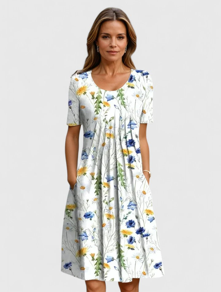 Elegant women's floral A-line midi dress with short sleeves and convenient pockets, perfect for spring/summer parties.