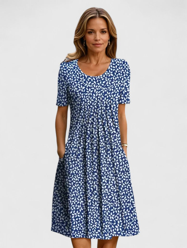 Chic women's elegant A-line floral dress, a stylish midi with short sleeves and discrete pockets for party wear.
