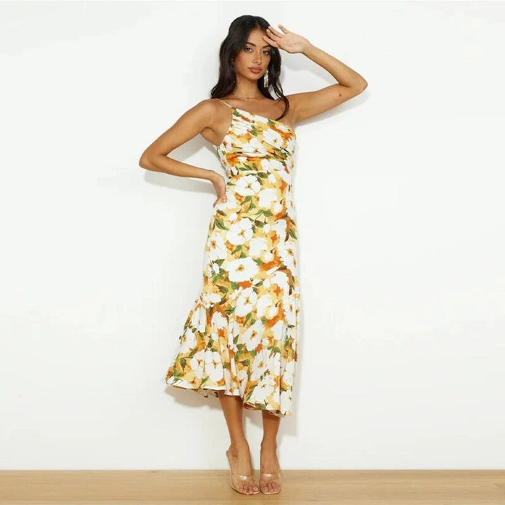 Women's vibrant floral print asymmetrical maxi dress, a fashionable sleeveless design for summer.