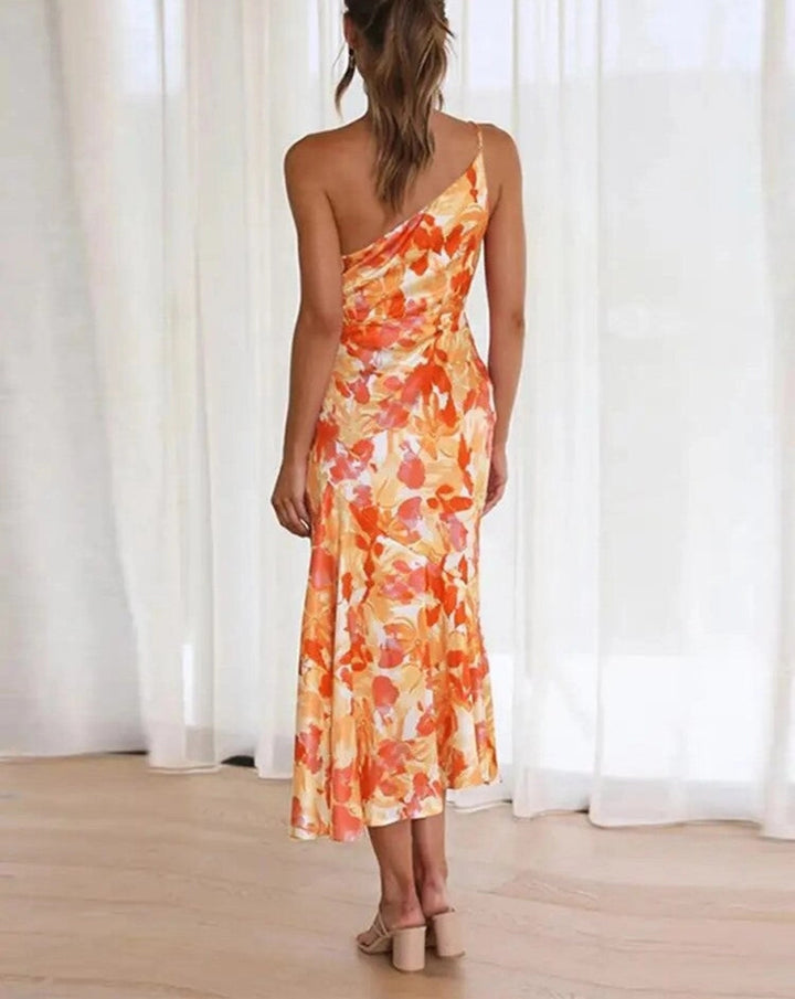 Elegant sleeveless floral maxi dress, women's asymmetrical design for summer fashion and festivities.