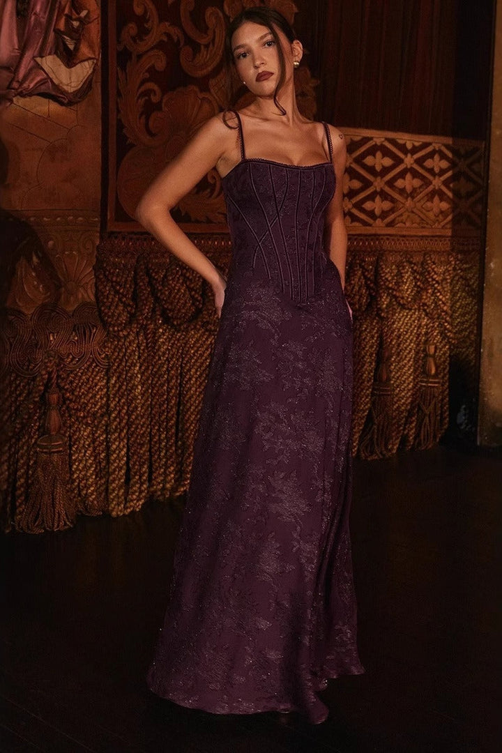 Chic black floral formal maxi dress for women, with spaghetti straps, ideal as a wedding guest or gala outfit.