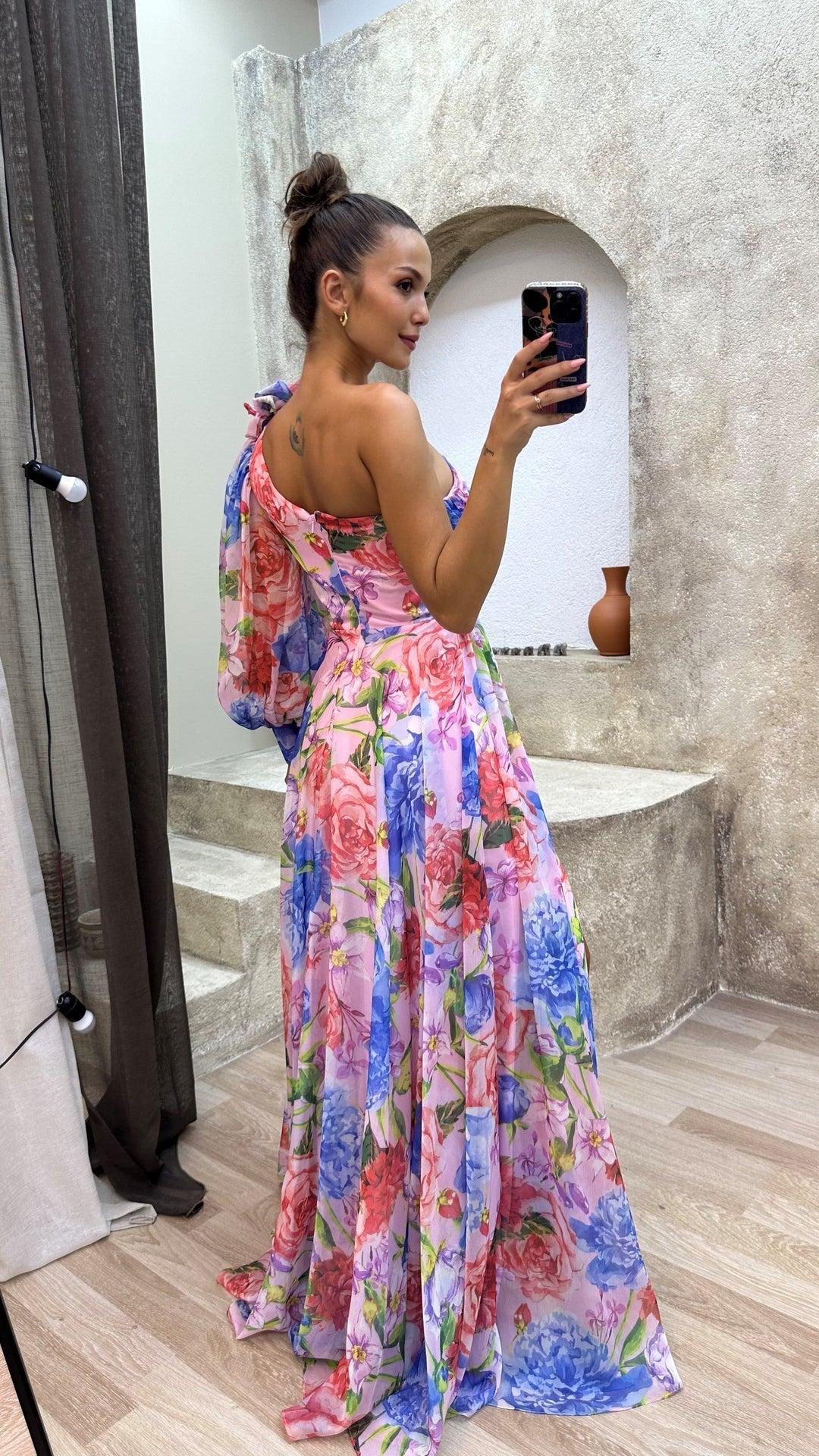 Flowy long dress for women featuring a vibrant floral pattern and stylish side slit