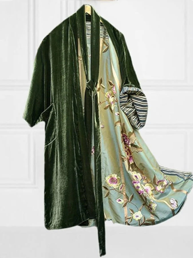 Flowy women's floral midi cardigan dress with an adjustable waist belt, ideal for casual or elegant looks.