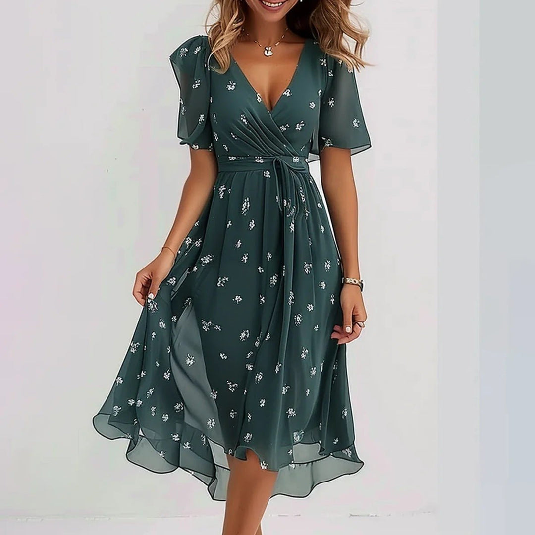 Vibrant floral print women's midi dress with elegant flutter sleeves, a perfect summer party or vacation outfit.