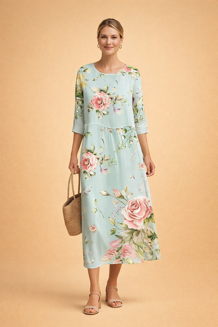 Elegant women's floral midi dress with relaxed fit, three-quarter sleeves & round neck. Perfect for spring/summer.