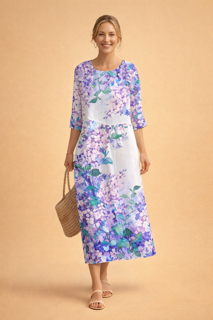 Women's elegant floral midi dress, styled outdoors. Perfect relaxed fit for spring/summer vacation outfits.