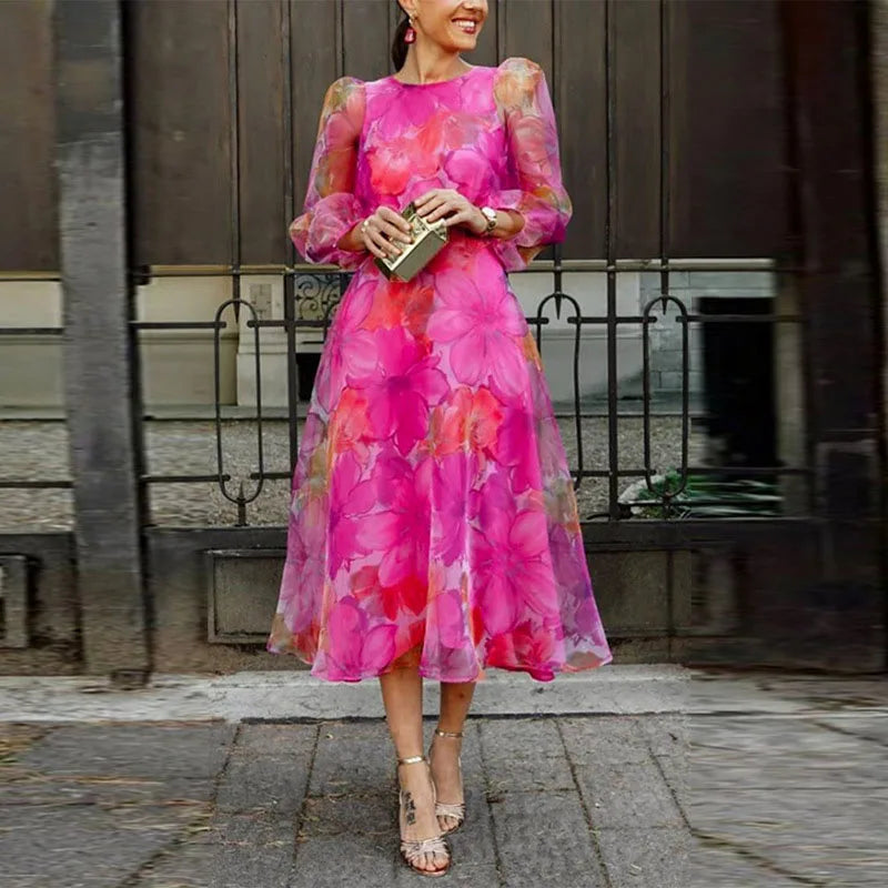 Elegant women's floral pink and blue midi dress, perfect for wedding guests or formal summer events.