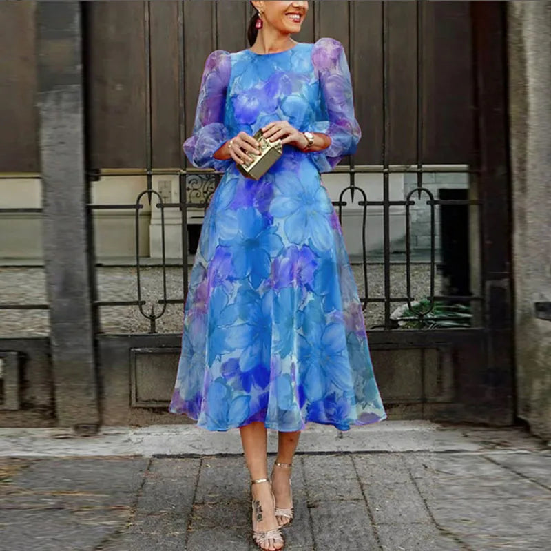 Women's formal floral midi dress with pink and blue patterns, ideal elegant party attire for wedding guests.