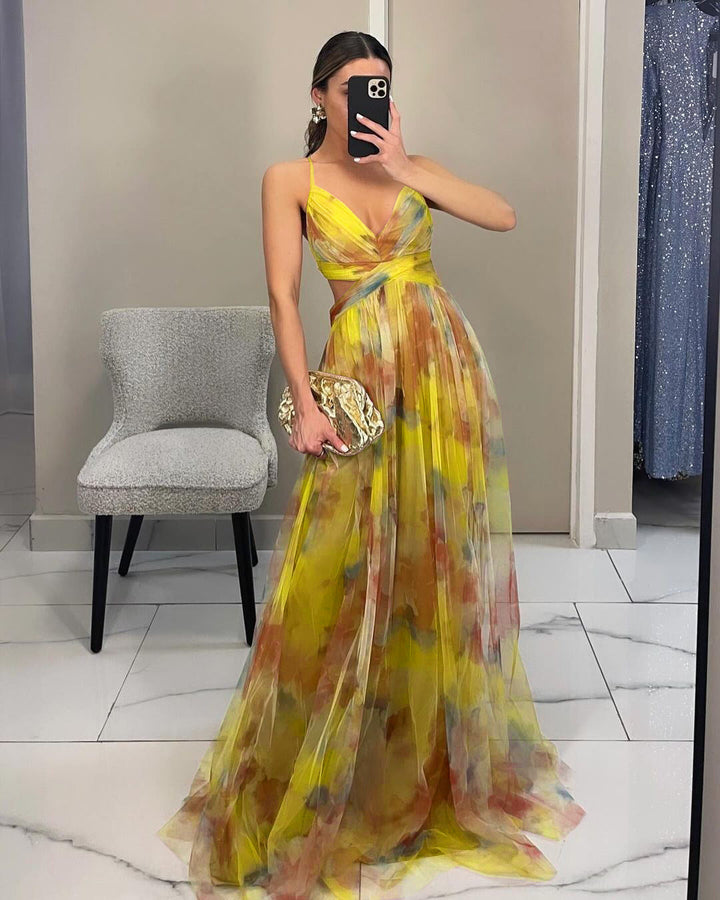 Beautiful floral print evening gown for women, suitable as a wedding guest dress or party attire.