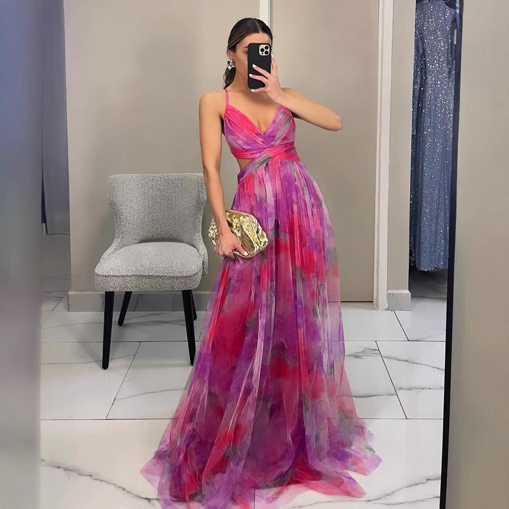 Formal women's evening dress, adorned with a vibrant floral print, perfect for sophisticated occasions.