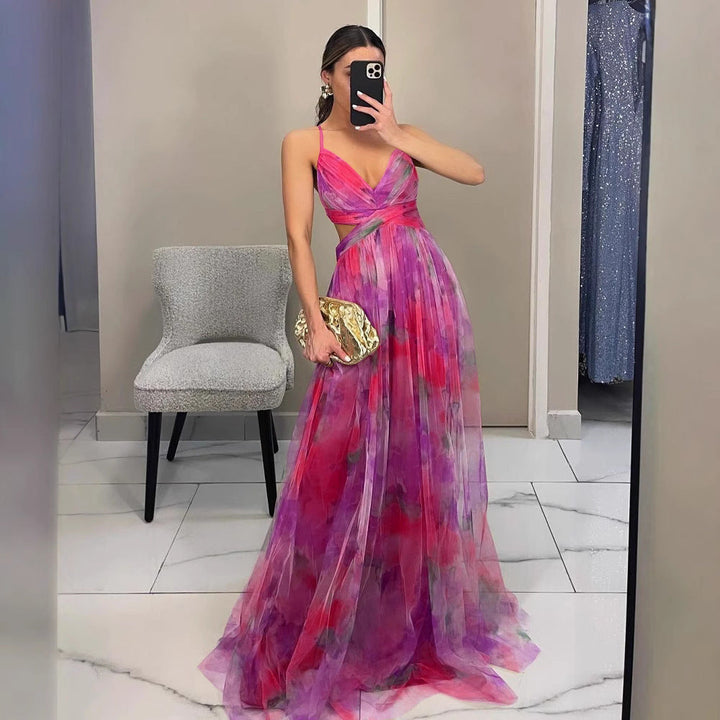 Formal women's evening dress, adorned with a vibrant floral print, perfect for sophisticated occasions.
