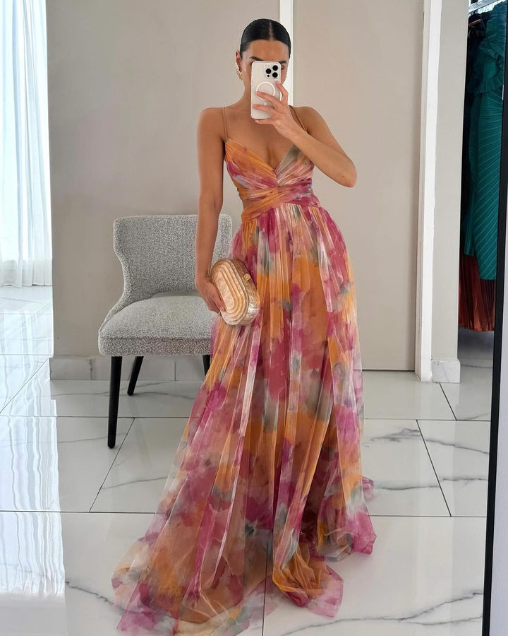 Elegant women's floral print maxi dress in vibrant spring colors, perfect for summer events.