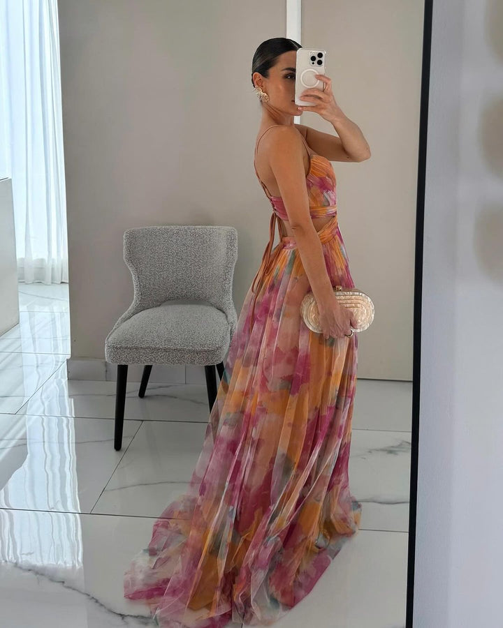 Flowing elegant floral print maxi dress for women, suitable for a spring or summer party.