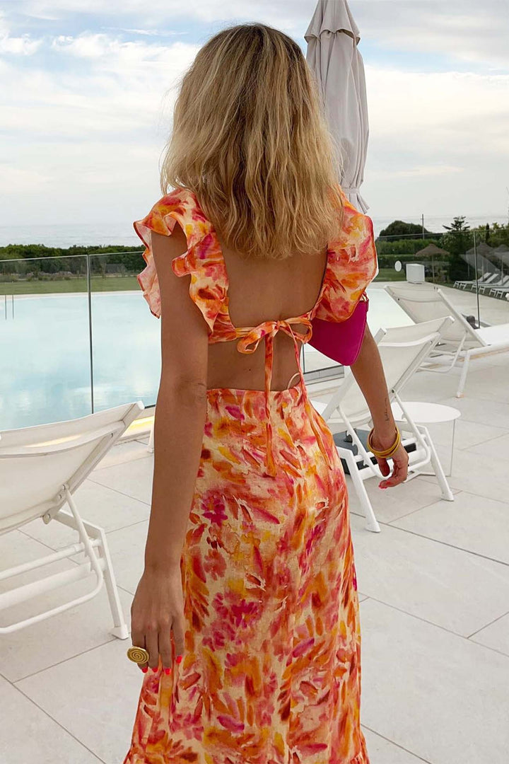 Women's long floral ruffle dress with a flowing silhouette, ideal for a sophisticated summer style.