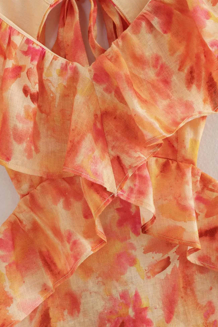 Sophisticated women's floral event dress with ruffle accents, offering a luxurious and comfortable look.
