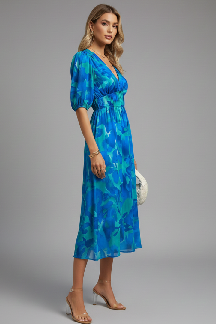 Flowy V-neck midi dress for women featuring a beautiful floral pattern and puff sleeves.