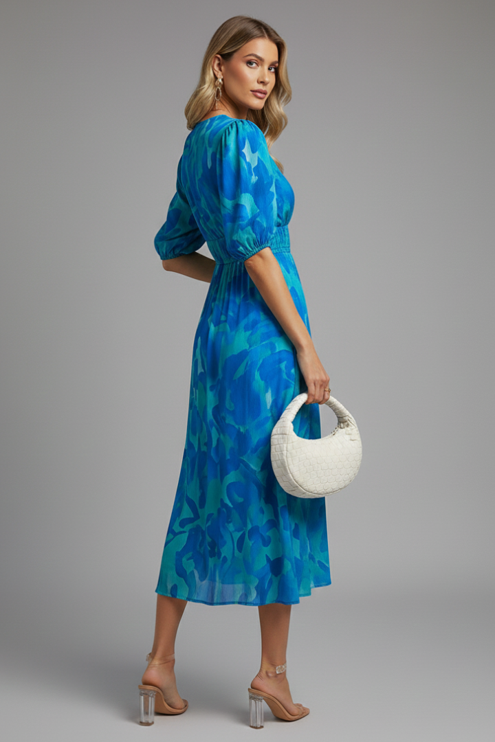Summer-ready women's floral print midi dress, designed with puff sleeves and V-neckline.