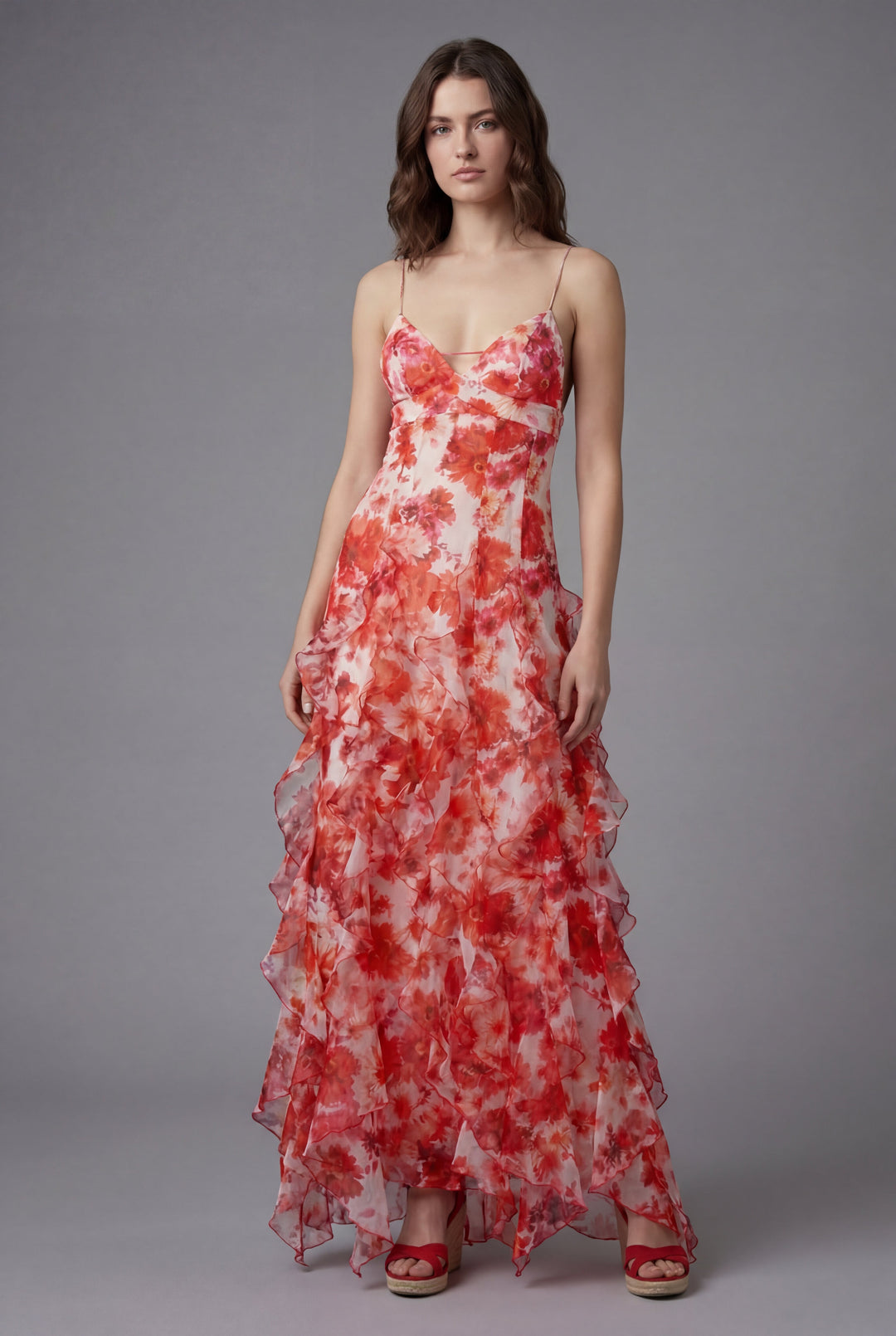 Elegant women's floral ruffle maxi dress with delicate spaghetti straps and alluring open back, perfect for summer occasions.