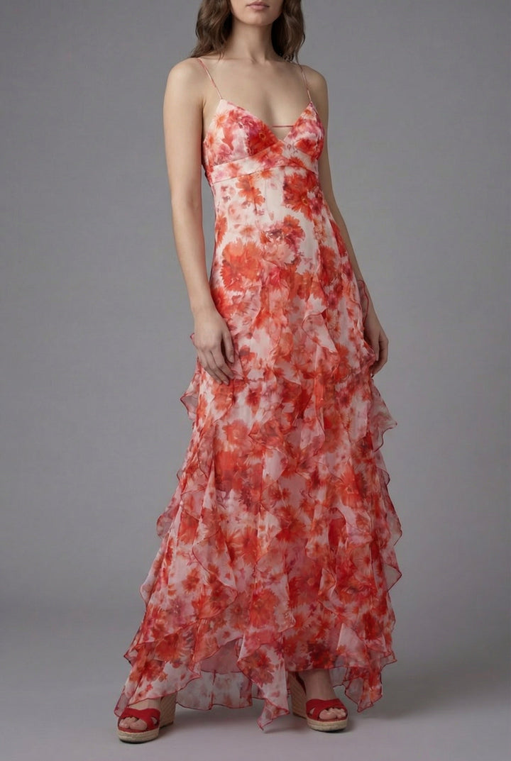 Flowy women's floral print maxi dress with ruffles, spaghetti straps, and open back, ideal for summer beach or resort wear.