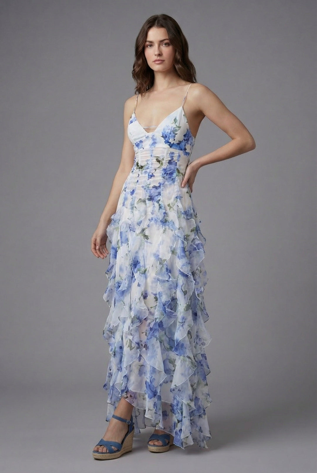 Beautiful women's floral spaghetti strap maxi dress featuring ruffles and an open back, great for elegant summer parties.