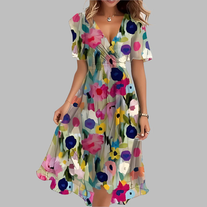 New women's floral ruched midi dress featuring a flattering sweetheart neckline and puff sleeves.