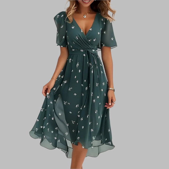 Stylish ruched midi dress in a satin floral print, ideal for women's summer fashion and event wear.